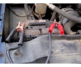 Jumper cables charging a car battery. (Photo: closeup of jumper cables 