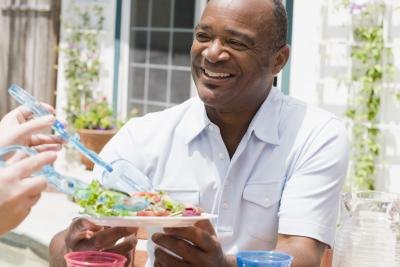 Smiling man with salad