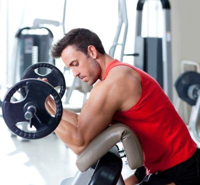 Man strength training at a gym