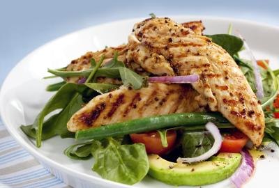 A salad with grilled chicken