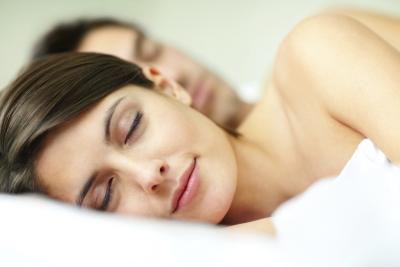 Couple sleeping in bed