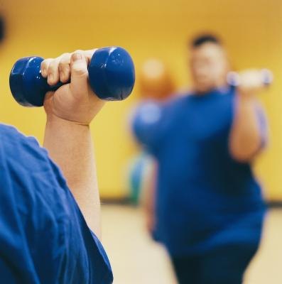 Exercising with weights.