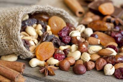 Nuts and dried fruit on a wooden surface