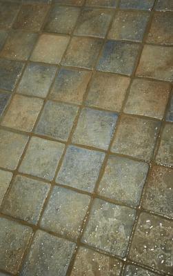 How to Remove Old Shower Tile From a Concrete Slab