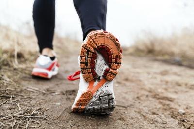 Woman's feet walking on trail