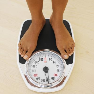 Woman weighing herself