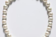 A single string of pearls speaks elegance and simplicity.