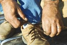 Coiled laces are made with a boat shoe knot, also known as a barrell tassel or an Eastland knot.