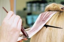 Applying a red-based toner can correct a hair color imbalance.