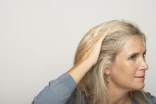 Adding darker colors, or lowlights, can help light-colored hair look more natural.
