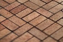 How to Remove Calcium Deposits From a Red Brick Driveway