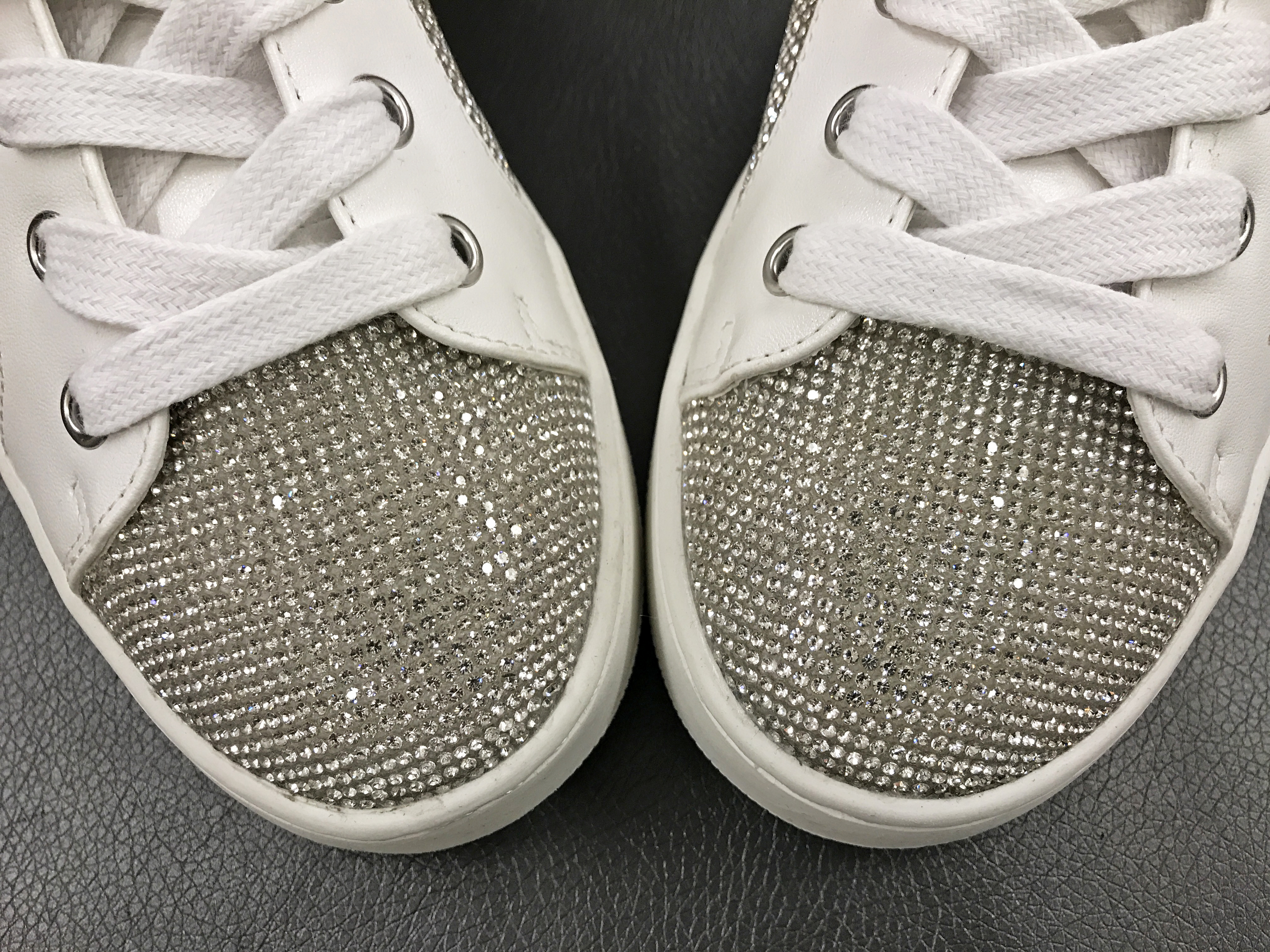 What's the best way to attach rhinestones to stretch knit fabric I will use  for dancing? Iron-on hotfix ones or glue on flat back rhinestones with  E6000? I need to cover A