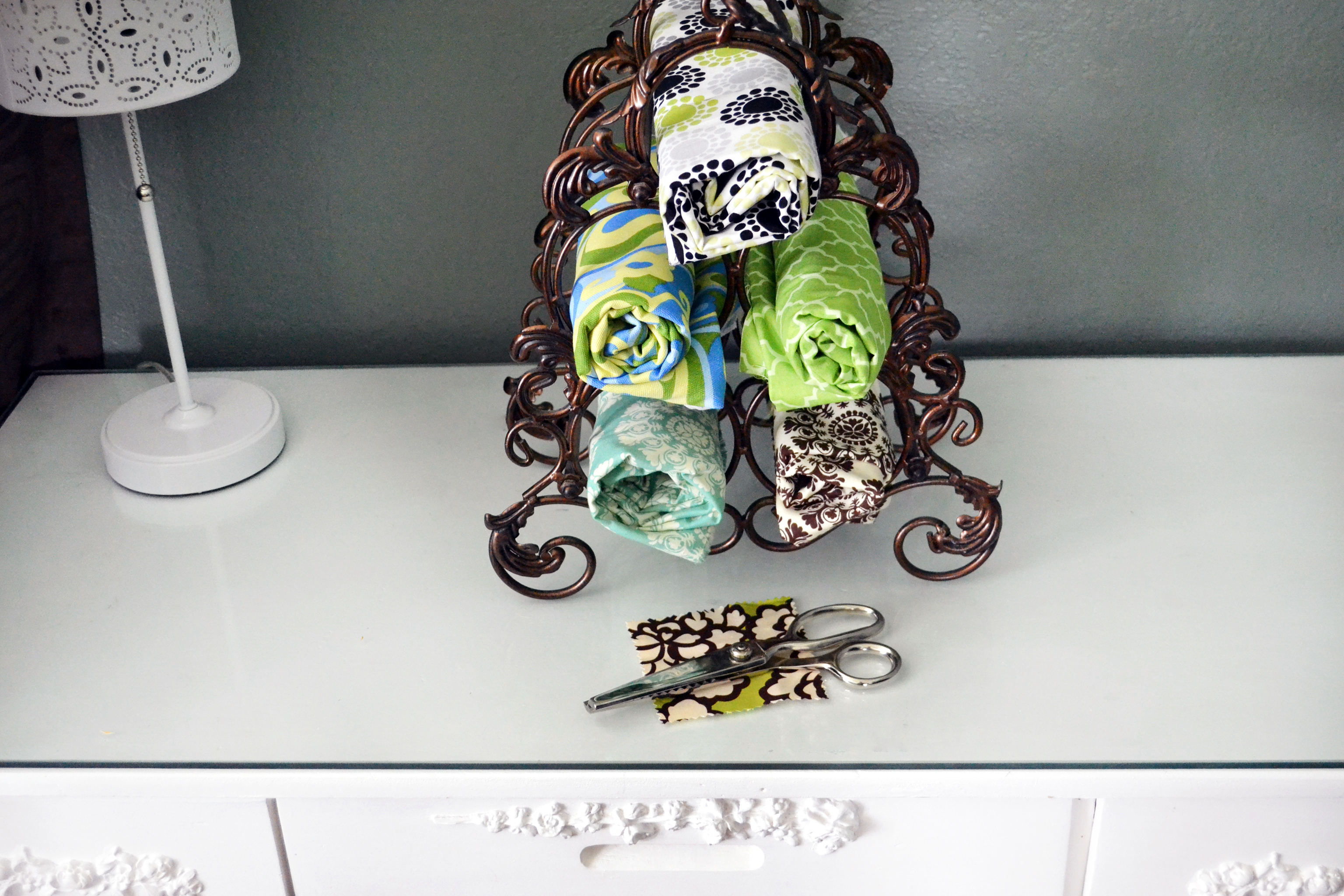 A coat of bright paint and an old wine rack is repurposed as storage/display  for stuf…