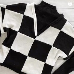 Closeup of black-and-white checkered sweater