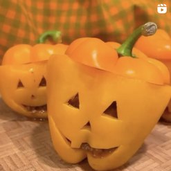 Stuffed peppers that look like mini jack o'lanterns