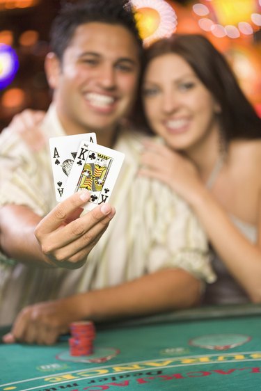 Man Holding Winning Blackjack Cards