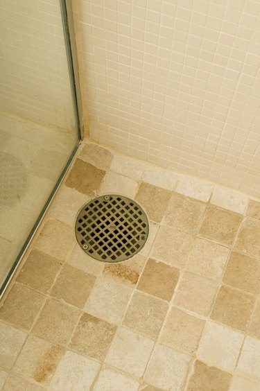 Drain in shower on tile floor