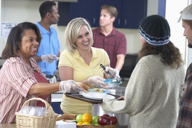 Women serving food at soup kitchen