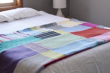 Snuggle up with a good book, a warm cup of tea, and your favorite jammies under this upcycled sweater quilt that you made yourself.