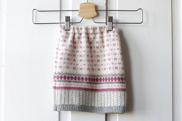 Pull out an old sweater from the bottom of your closet and create a cute and cozy sweater skirt for a little girl in your life.