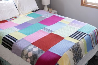 Snuggle up with a good book, a warm cup of tea, and your favorite jammies under this upcycled sweater quilt that you made yourself.