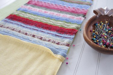 Snuggle up with a good book, a warm cup of tea, and your favorite jammies under this upcycled sweater quilt that you made yourself.