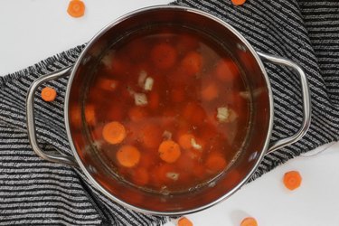 Boil carrots and vegetable stock