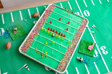 Stadium cake baked into sheet pan and decorated with gummy bears and sprinkles