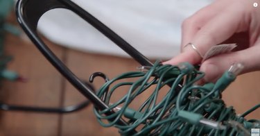 Clothes hangers used for Christmas lights.