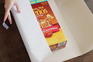 Wrapping cereal box with white paper