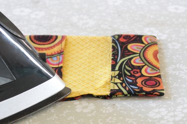 Whip up a card holder from some fabric scraps and keep your business cards organized and clean.