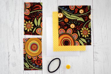 Whip up a card holder from some fabric scraps and keep your business cards organized and clean.