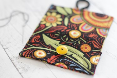 Whip up a card holder from some fabric scraps and keep your business cards organized and clean.