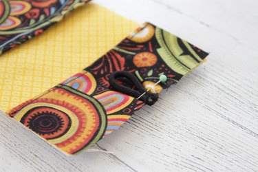 Whip up a card holder from some fabric scraps and keep your business cards organized and clean.