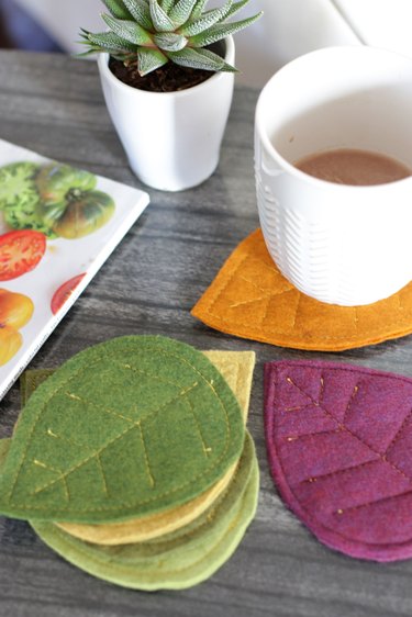 Bring that colorful fall feeling inside your home by creating a few vibrant felt coasters to protect your coffee table from those steaming cups of hot cocoa you'll be sipping.