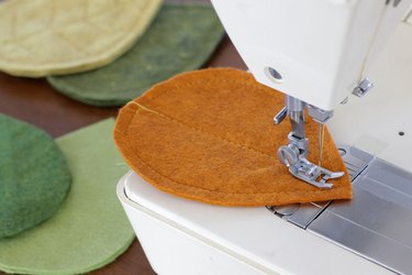 Bring that colorful fall feeling inside your home by creating a few vibrant felt coasters to protect your coffee table from those steaming cups of hot cocoa you'll be sipping.