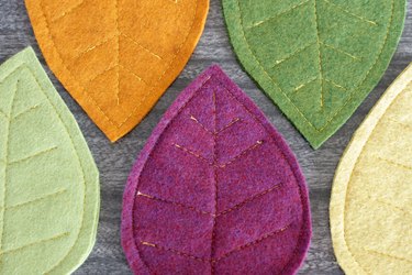 Bring that colorful fall feeling inside your home by creating a few vibrant felt coasters to protect your coffee table from those steaming cups of hot cocoa you'll be sipping.