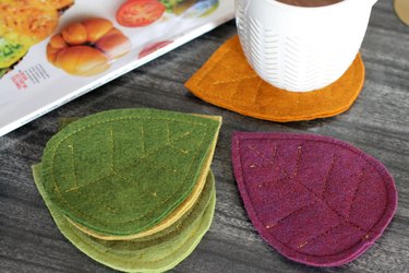 Bring that colorful fall feeling inside your home by creating a few vibrant felt coasters to protect your coffee table from those steaming cups of hot cocoa you'll be sipping.
