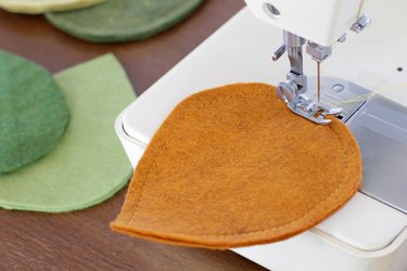 Bring that colorful fall feeling inside your home by creating a few vibrant felt coasters to protect your coffee table from those steaming cups of hot cocoa you'll be sipping.