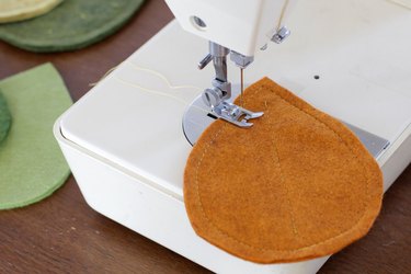 Bring that colorful fall feeling inside your home by creating a few vibrant felt coasters to protect your coffee table from those steaming cups of hot cocoa you'll be sipping.