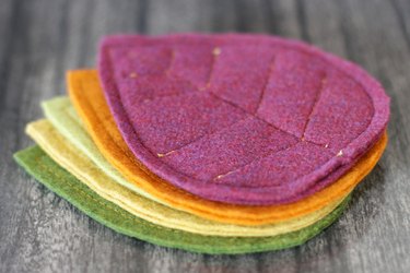 Bring that colorful fall feeling inside your home by creating a few vibrant felt coasters to protect your coffee table from those steaming cups of hot cocoa you'll be sipping.