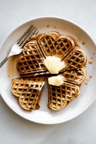 Serve the waffles with a pat of butter and an extra drizzle of maple syrup!