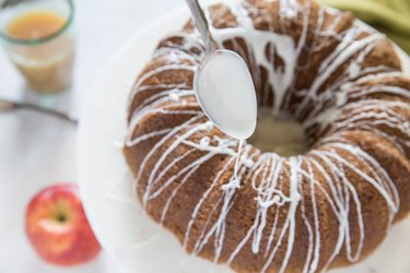 Cake being drizzled with glaze