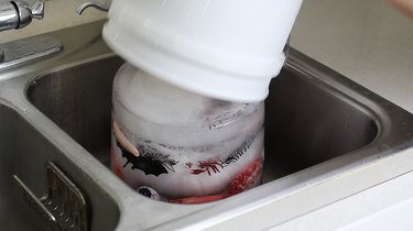 Sliding ice bucket out of plastic bucket