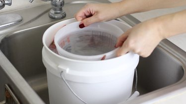 Sliding smaller bucket out of larger one