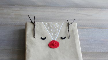 Twigs glued to top of box for antlers