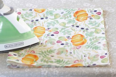 This holiday season, keep your rolls fresh and, at the same time, add some serious style to your table with a DIY fabric roll cover.