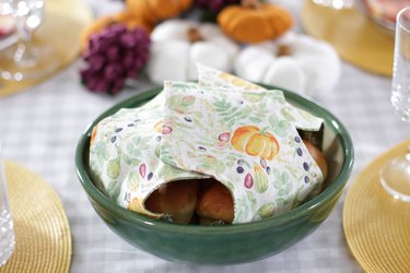 This holiday season, keep your rolls fresh and, at the same time, add some serious style to your table with a DIY fabric roll cover.