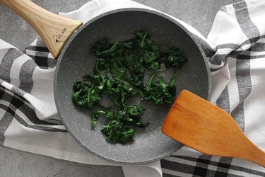 Cook spinach until wilted