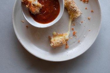 Dip the mozzarella sticks in the sauce for something even more delicious.